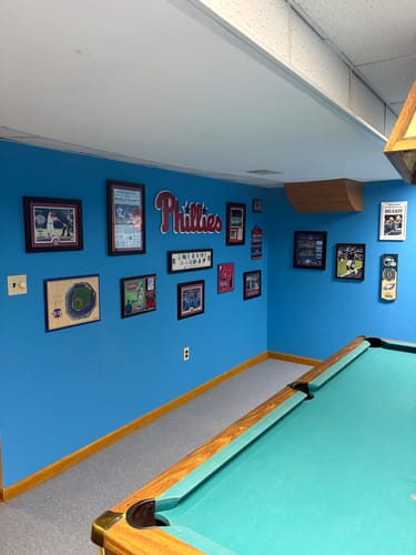 Reviewer's Philadelphia Phillies Script 3D Metal Wall Art hanging on a blue wall in a basement fan cave.