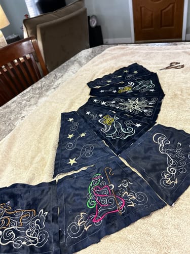Customer's intricate nativity scene embroidered on dark fabric using the bobbin thread.