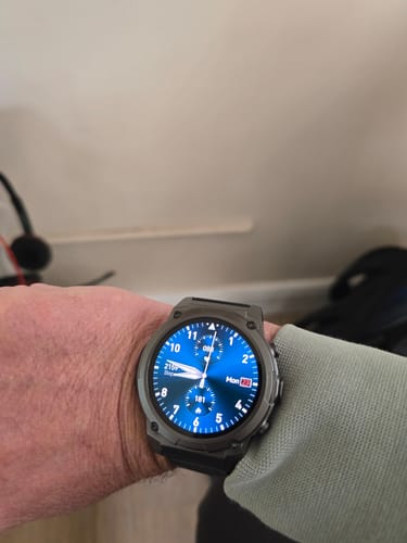 Customer's Gard Pro Ultra 3 watch with a dark case and a vibrant blue digital display on their wrist.