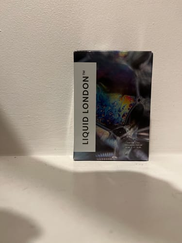Customer's box for the For Him Pheromone Perfume standing on a white shelf.