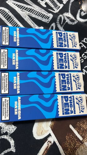 Customer's four stacked boxes of the ROLLZ THCA Vape pen in the Amnesia Haze strain.