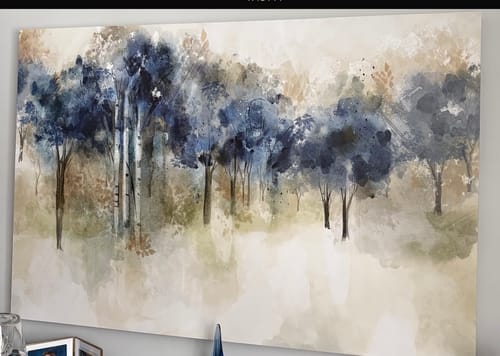 Customer's 'Forest Dream' Framed Canvas hanging on a wall, showing an abstract forest scene in blue and brown hues.