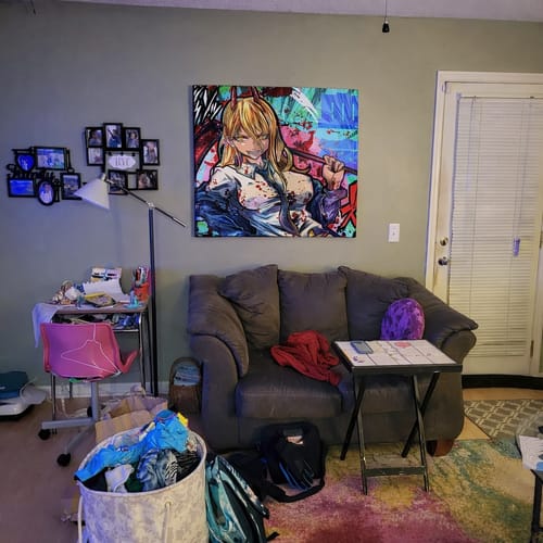 Reviewer's large Power Chainsaw Man Wall Art mounted on a gray wall above a loveseat in a living room.
