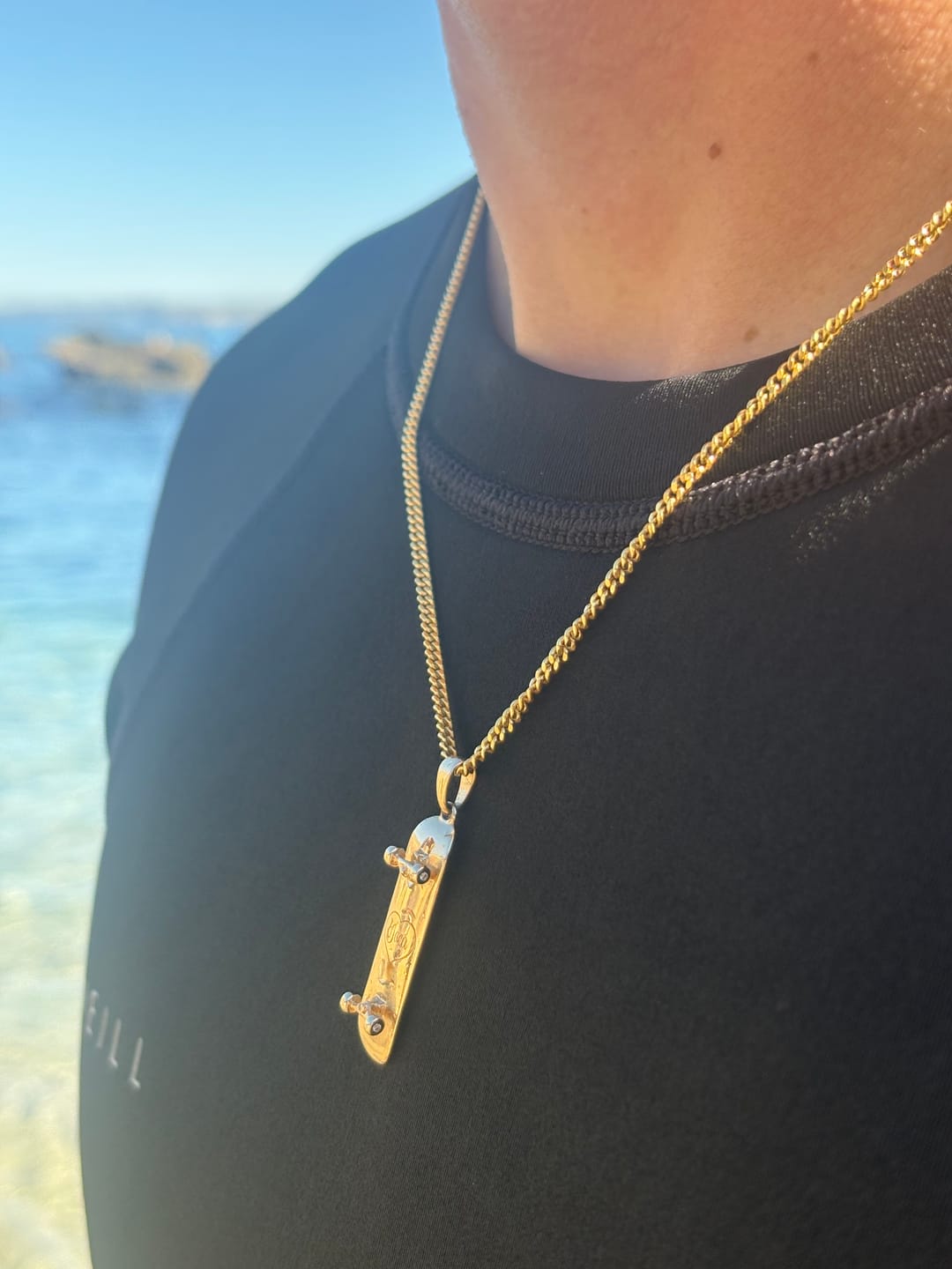 Customer photo review of DIAMOND EDITION 14K Solid Gold Skateboard Pendant