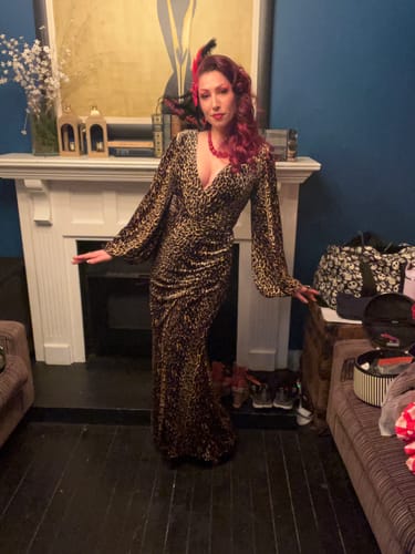 Reviewer posing backstage in the elegant leopard velvet Film Noir Gown.