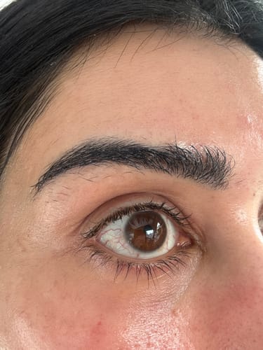 Reviewer's close-up of their eye, showing hydrated skin after using the SkinCeuticals AGE Advanced Eye cream.