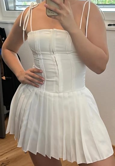 Customer photo review of Kerina Sleeveless Pleated Mini Dress