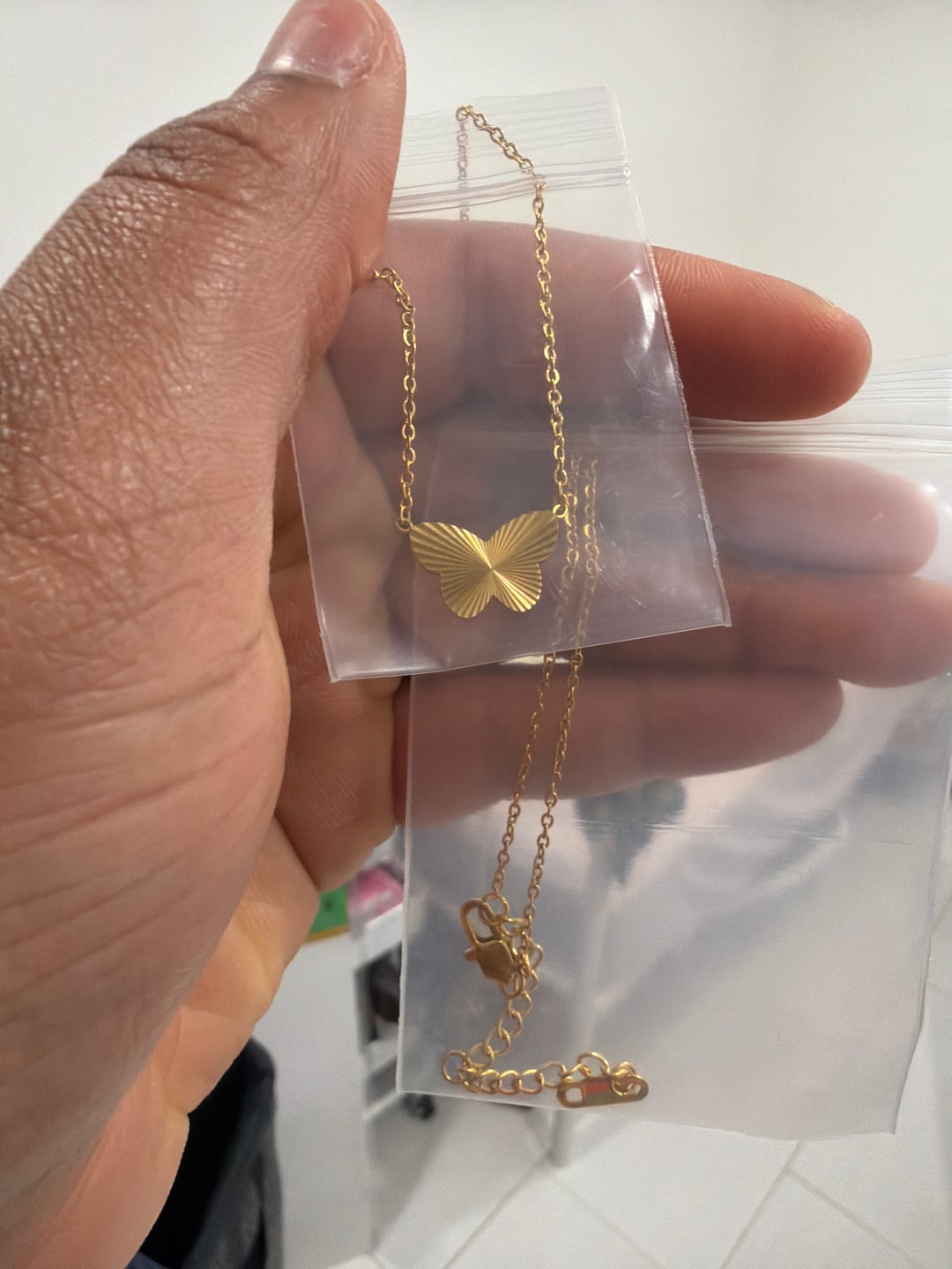 Customer photo review of Butterfly Symbol Necklace