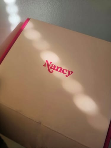 Customer's packaging for their Lem Clitoral Massager, showing the white and pink branded box.