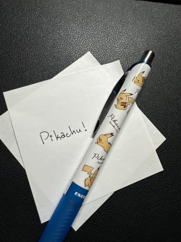 Customer's Pentel Energel Pikachu pen on a note with 'Pikachu!' handwritten, demonstrating the pen's fine tip.