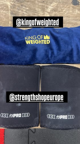 Customer's black 7mm PRO LITE Elbow Sleeves laid flat next to the blue product storage bag.