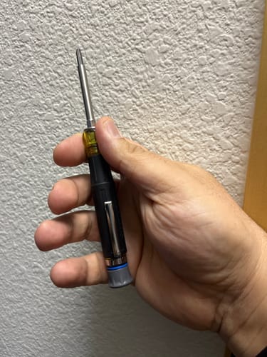 Customer holding the Klein Tools multi-bit pocket precision screwdriver in their hand.