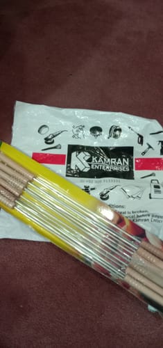 Customer's new BBQ Skewer Set in its original packaging on a dark surface.