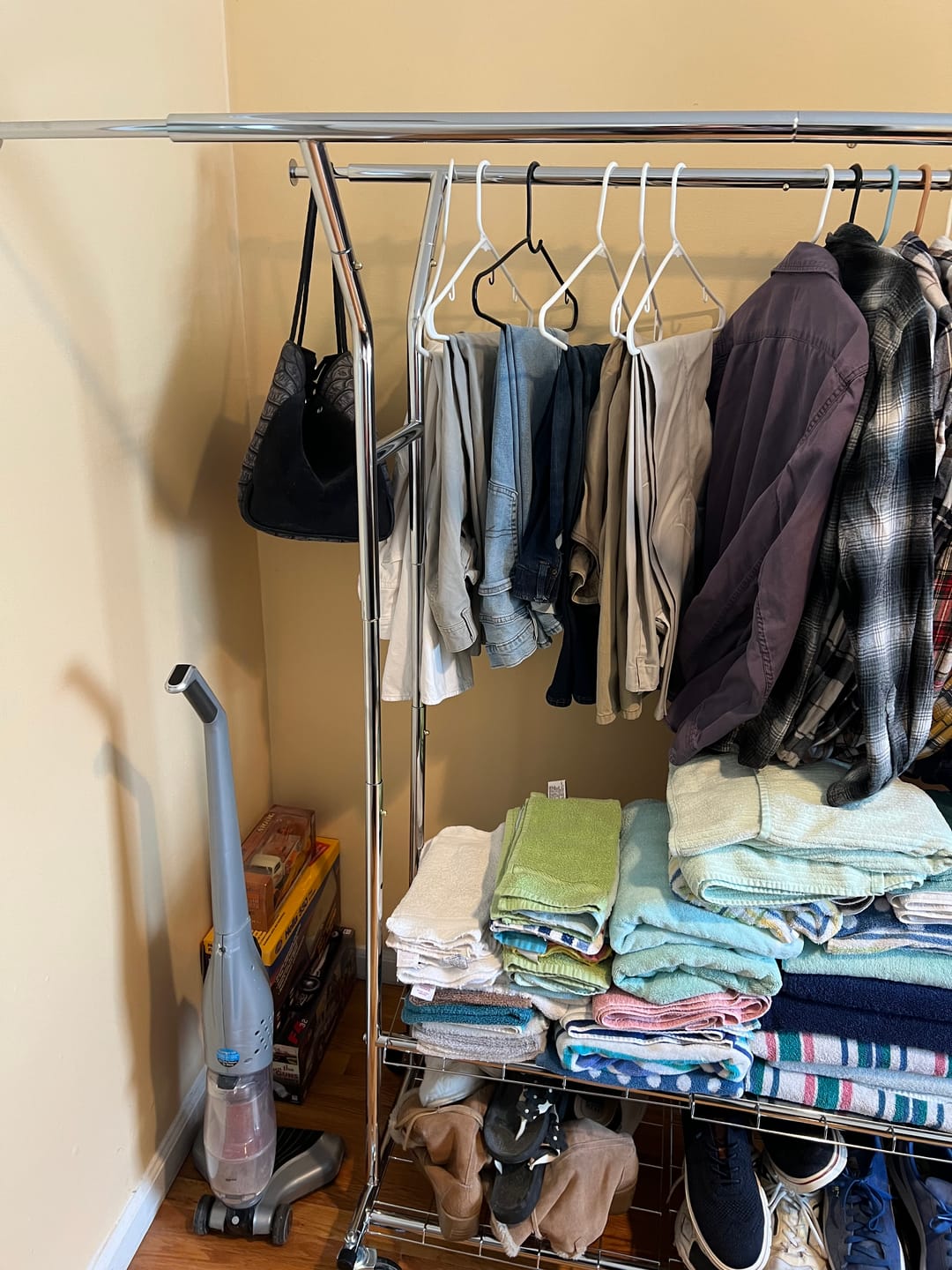 Customer photo review of Raybee 74"W Heavy Duty Clothes Rack on Wheels, 630LBS Adjustable Double Rod Garment Rack, Chrome Metal Commercial Clothing Rack with Storage Shelves