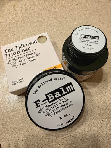 Customer's Tallowed Truth Starter Pack items, including F-Balm, soap, and lip balm, on a countertop.