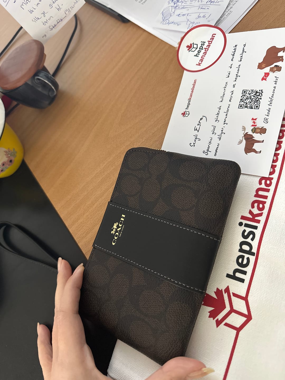 Customer photo review of Coach Women's Corner Zip Wristlet In Signature Canvas With Stripe Gold/Walnut/Black