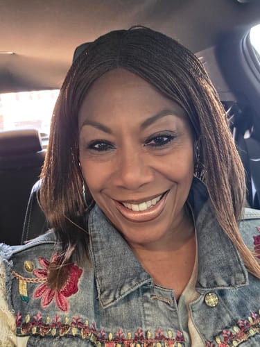 Customer smiling, showing her long lashes after applying My Amazing Lashes Mascara.