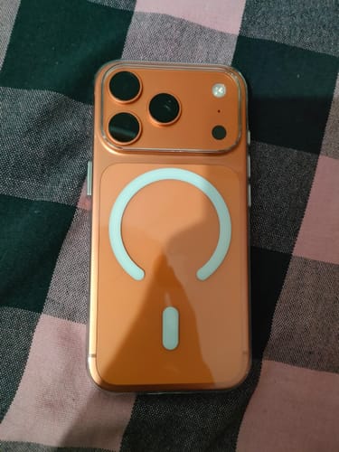 Customer's Anti Yellow Magsafe Transparent Clear Case on an orange phone, showing the back with the MagSafe ring.