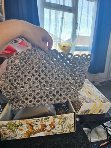 Reviewer holding the partially assembled ring-crochet section of their Garden Bee Crochet Bag Kit.