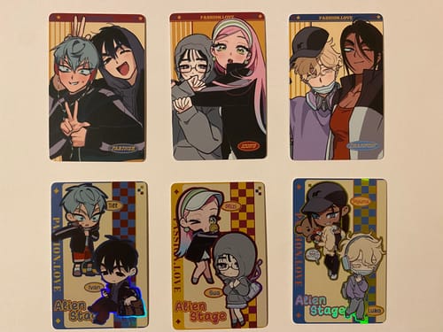 Customer's six Alien Stage mini cards laid out. The set includes three glossy and three holographic cards with anime characters.