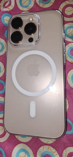 Customer's Anti Yellow Magsafe Clear Case on a gold iPhone, showing the white MagSafe ring and raised camera protection.