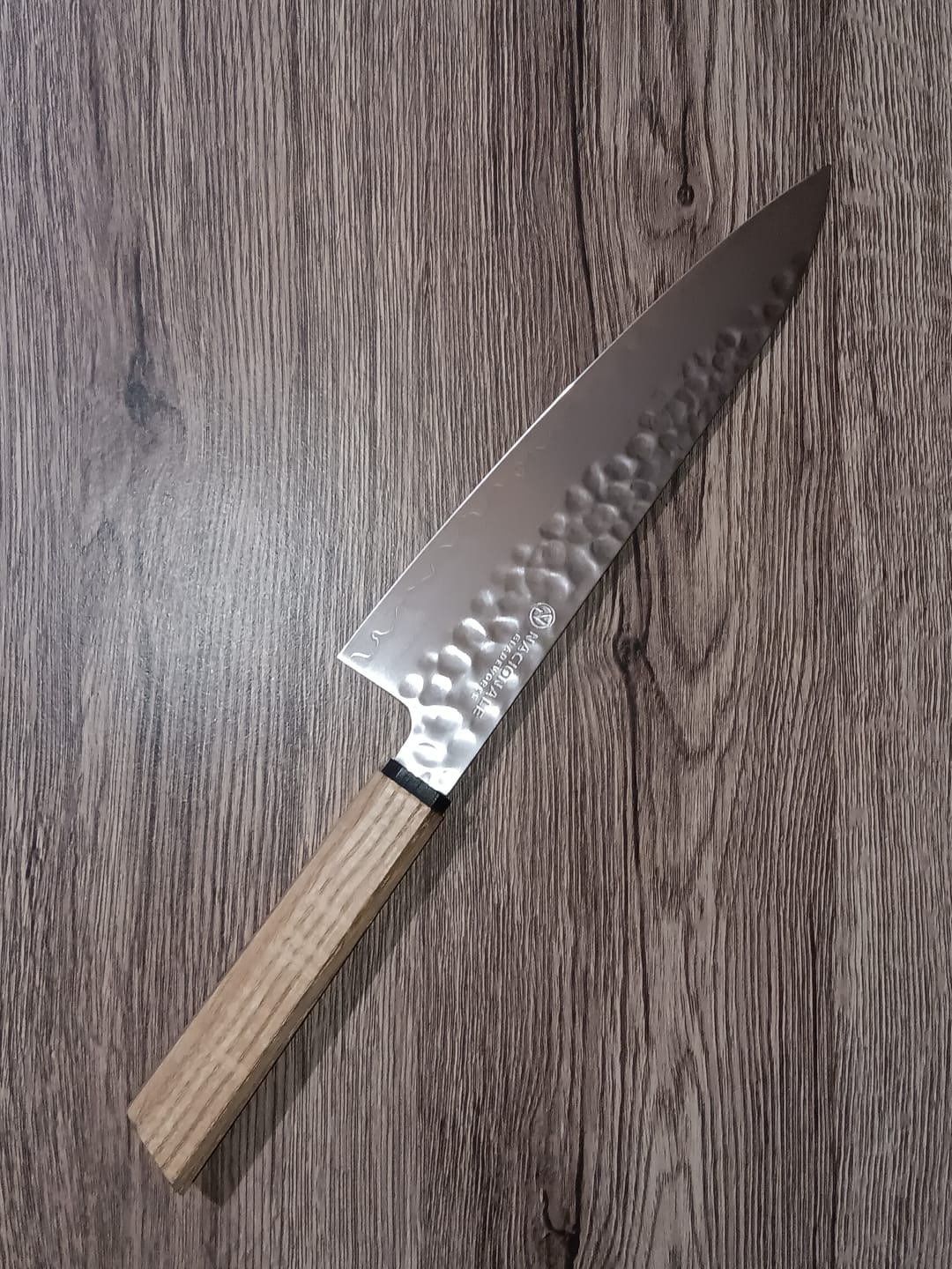 Customer photo review of 215mm Gyuto. Hammered San Mai 440C Stainless. Blue Pakka / Ebony / Oak