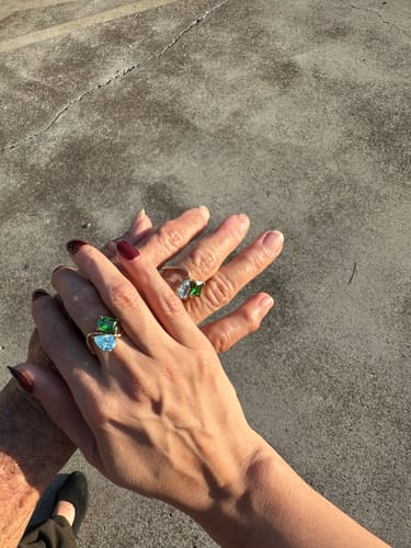 Customer and their mom holding hands, both wearing the Navae Birthstone Ring.