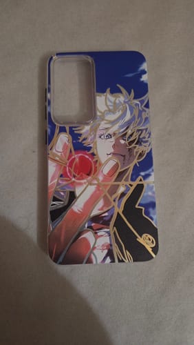 Reviewer's phone case with a blue and gold anime-style graphic of a character with white hair.