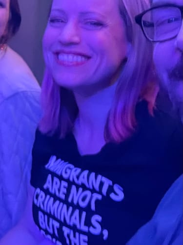 Customer photo review of Immigrants Women's V-Neck Tee