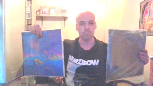 A reviewer holds up two Custom Vinyl Records, one with a colorful cover and one still in a plastic sleeve.