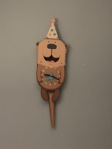 Customer photo review of Lola the Otter Pendulum Clock