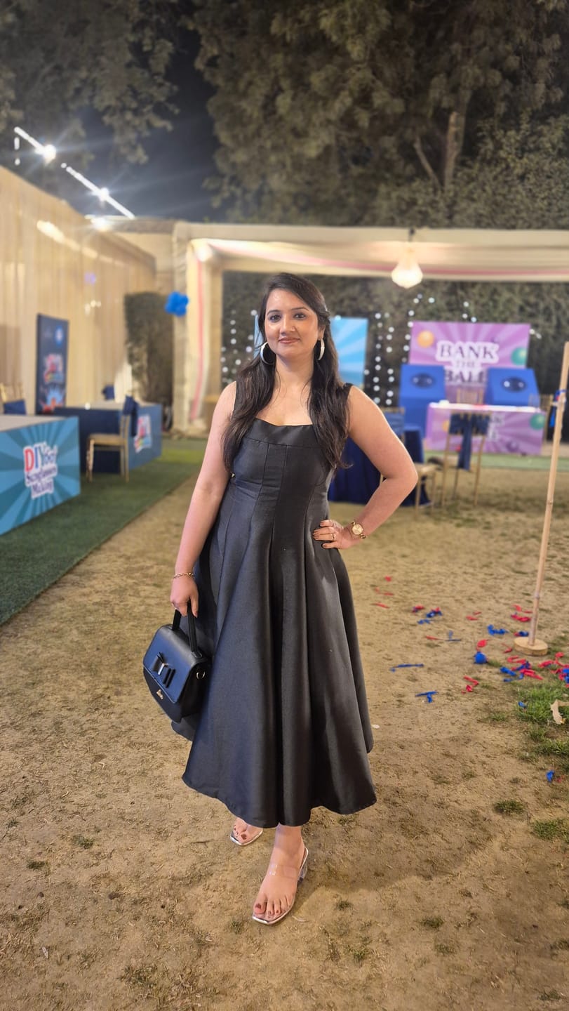 Customer photo review of Rigata Holiday Statement Maxi Dress in Black