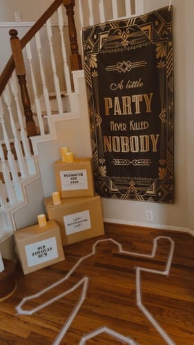 Customer's party setup for the 1920s Murder Mystery Game, showing a body outline and themed decorations.