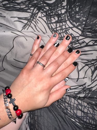 Customer's hands clasped together, one wearing the silver GRILL RING.