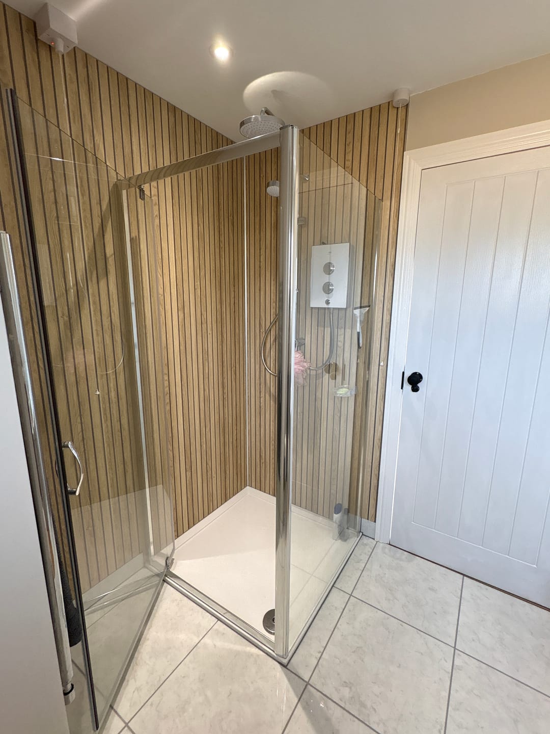 Customer photo review of Sivara Oak Slatted Wood Effect PVC Waterproof Shower Panel
