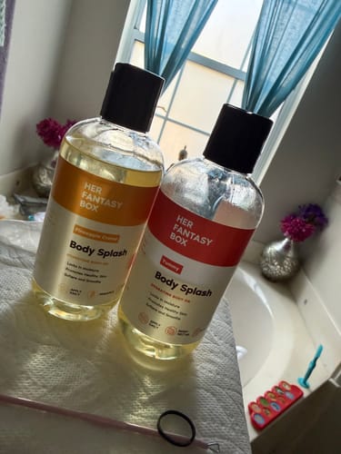 Customer's "Yummy" and "Pineapple Creme" Body Splash bottles sitting on a bathroom counter.