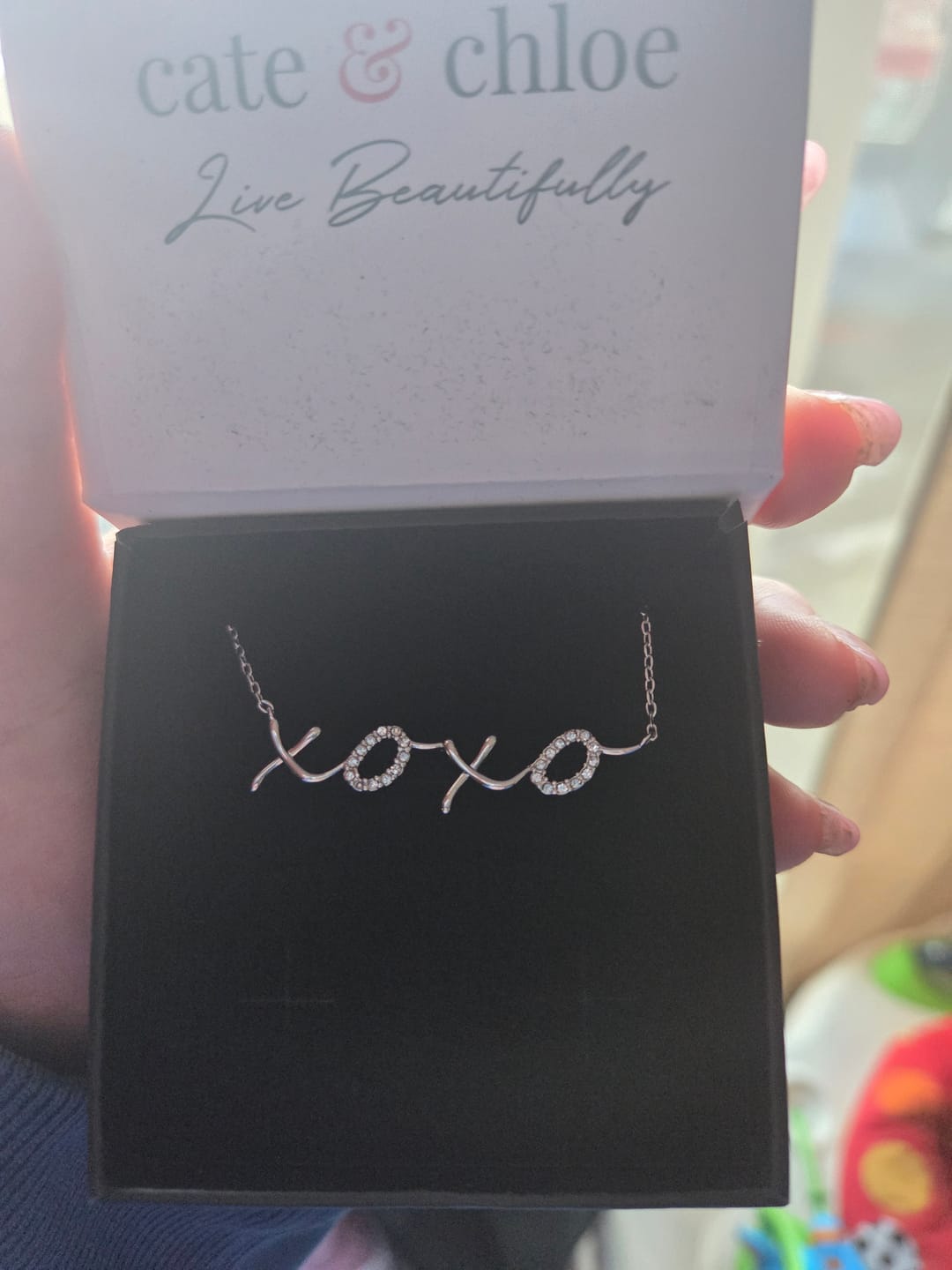Customer photo review of Jocelyn 18k White Gold Plated XOXO Pendant Necklace with Swarovski Crystals