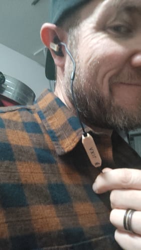 Reviewer wearing the GS Extreme 3.0 hearing protection, showing the fit of the earbud in their ear.