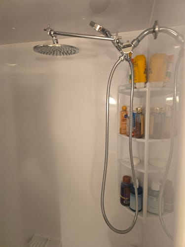 Customer's installed Dual Shower Head in a white shower, showing the round rain head and handheld unit.