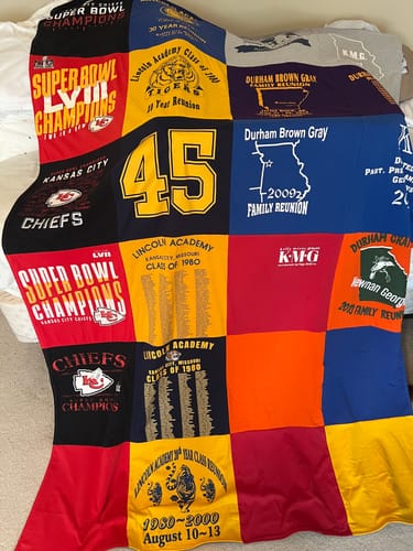 Customer's colorful Premium T Shirt Quilt made from Kansas City Chiefs and family reunion t-shirts.