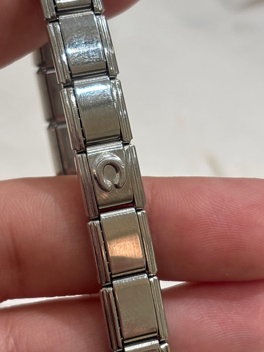 Customer photo review of Charm Inicial Plateada