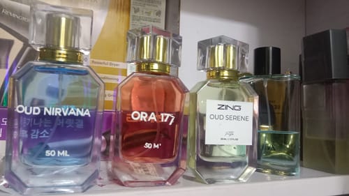 Customer's OUD Supreme BUNDLE perfumes, showing Oud Nirvana, Ora 177, and Oud Serene bottles on a shelf.