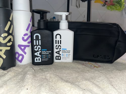 Customer's collection of Based Bodyworks products, including a cleanser, moisturizer, and large black beauty bag.