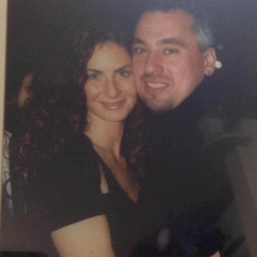 Customer's personal photo of a smiling couple embracing, used for their 'Your Song on YouTube' video.