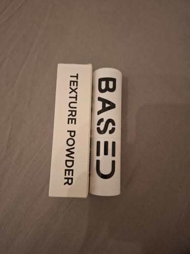 Customer's Based Texture Powder shown in its white container alongside the matching product box.