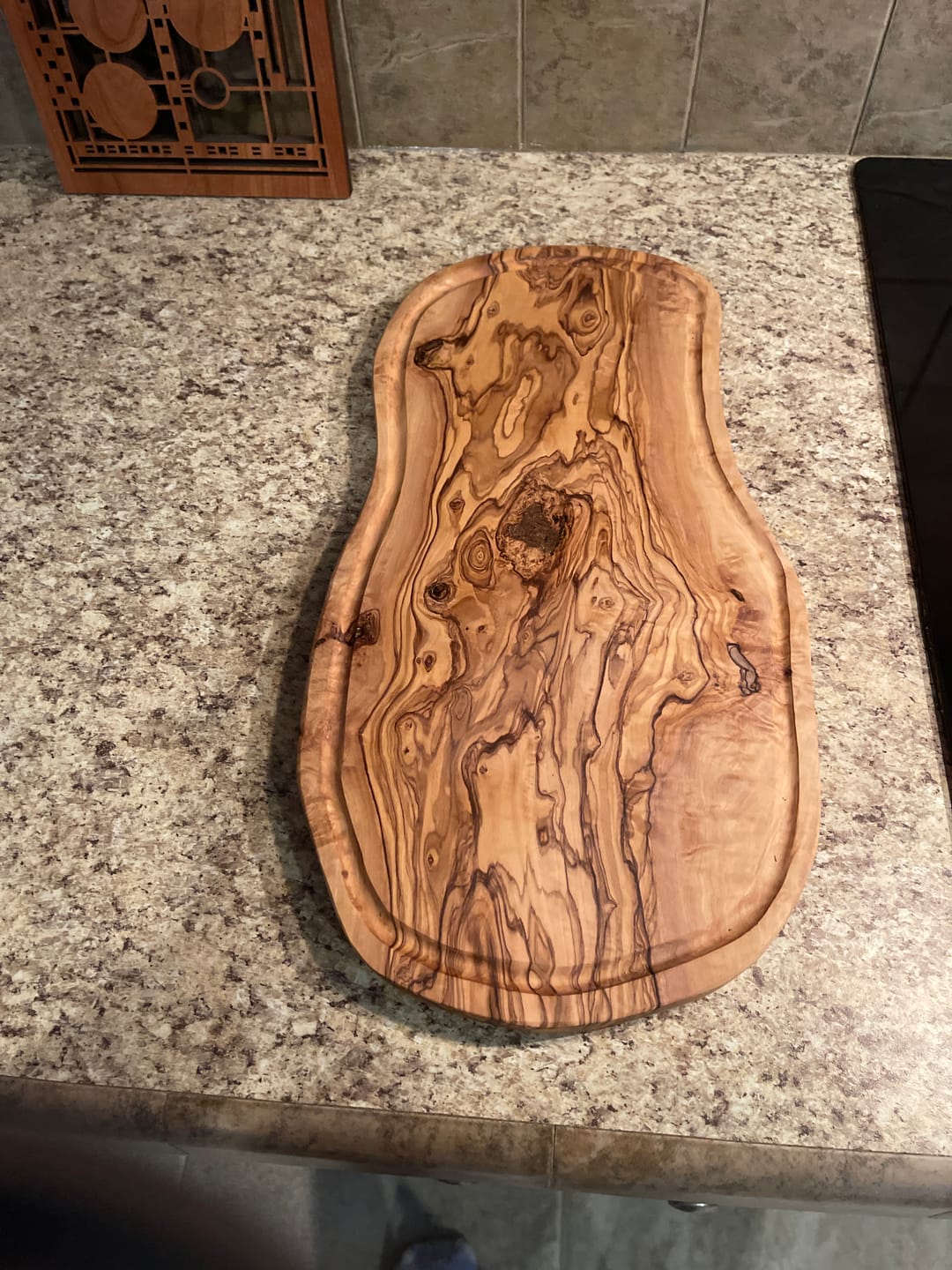 Customer photo review of Handmade Olive Wood Cutting Board with Juice Groove – 40x20 cm | Durable, Rustic & Eco-Friendly