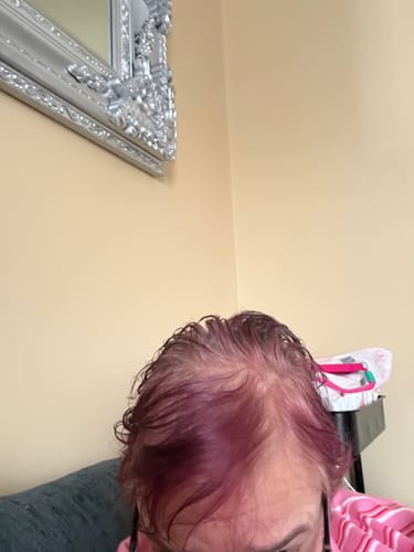 Reviewer shows their faded purple hair and visible roots before using the Instant Dye Shampoo.