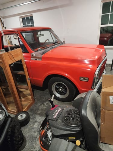 Customer's photo of the bright red classic truck, the subject of the Fast Pass - Lite screensavers, parked in a garage.