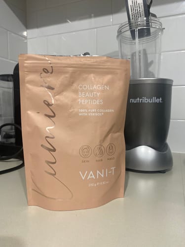 Customer's pouch of Lumiere Collagen Beauty Peptides sitting on a kitchen counter next to a personal blender.