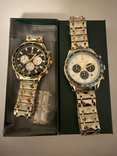 Customer's two Lucky Fours® Chronometer watches, one with a black face and the other with a white face and blue bezel.